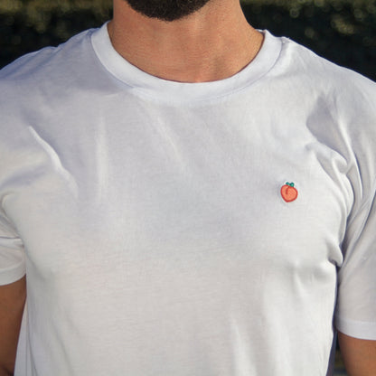 Close-up of the chest on an Out Now! t-shirt, highlighting the peach pattern placement.